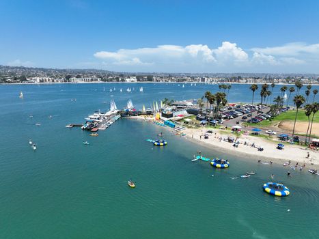 Aerial view of boats and kayaks in Mission Bay water sports zone in San Diego, California. USA.