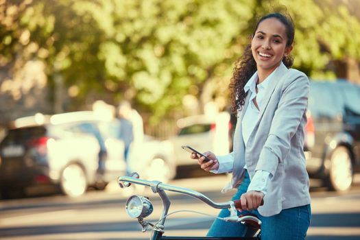 Business woman, bicycle and taking a mobile break outdoors in the street. Working lady in business travels with sustainable transport. Carbon neutral worker enjoys exercise and bike ride outside.