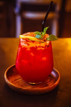 Fresh summer red drink mocktail in glass decorate with fruit and vegetable business industry beverage cafe shop.