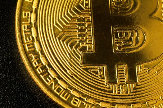 Macro photography of bitcoin gold on black background