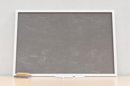 Blank chalkboard in light classroom
