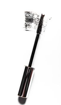 Black mascara brush stroke close-up isolated on white background