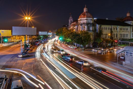 A night shot of cars moving on Strand Rd in Yangon, Myanmar