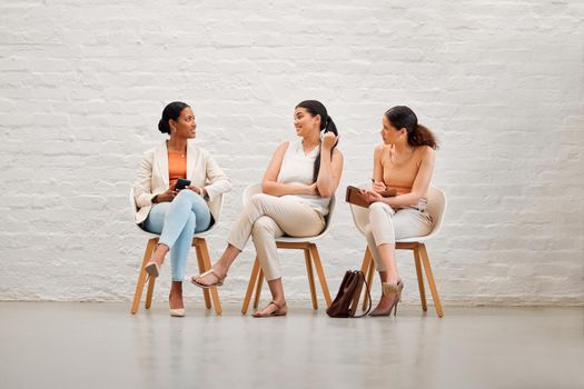 Women in waiting room for interview, hiring or recruitment meeting with hr for fashion designer job. Creative girls or future company employees in search of employment in design industry field