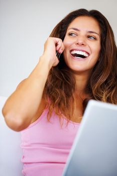 Remote, working and freelance woman with phone call talking, networking and online communication or conversation on laptop technology. Smile, success and excited person with smartphone for contact us.