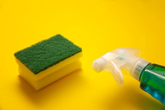 liquid detergent in sparay bottle and sponge