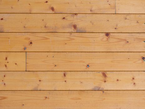 Authentic wood planks in the wall of cabin, texture of spruce wood
