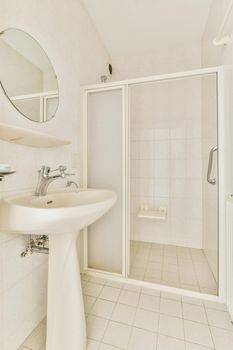 Toilet with white tiled walls