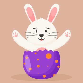 Cute Easter bunny is sitting in an Easter egg. Easter concept