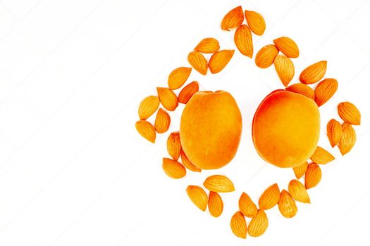 Fresh ripe apricot fruits with kernels isolated on background