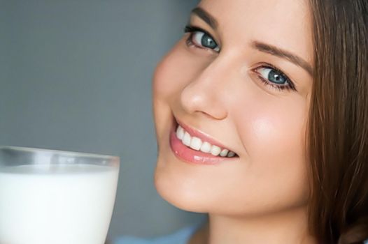 Diet and wellness, young woman with glass of milk or protein shake cocktail