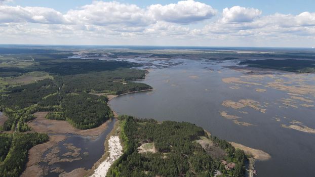 Photo of the Dnieper River from flight altitude, drone shooting. Forest next to the river