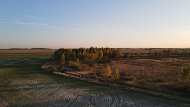 Aerial top view photo from flying drone of a land with down fields in countryside.