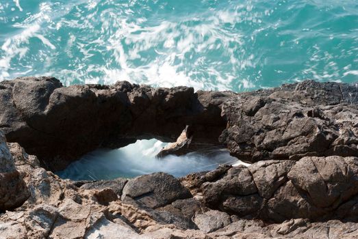 Rock at coastline sea water eroded