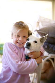 Hes my best friend. Portrait of a little girl embracing her dog.