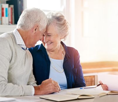 So glad to be living a worry-free retirement together. a senior couple together at home.