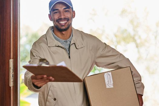 All I need is a signature. Cropped portrait of a handsome young man delivering your package.