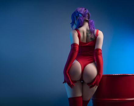 sexy girl in red bodysuit stockings shows off her big buttocks