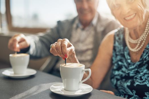 Coffee is a brew best shared. a mature couple spending the day together.