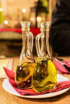 Bottles of organic extra virgin olive oil in Italian restaurant