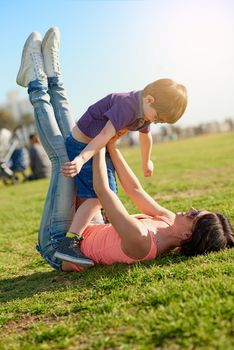 Sunshine and fun times are the best. a mother and son enjoying a day at the park together.