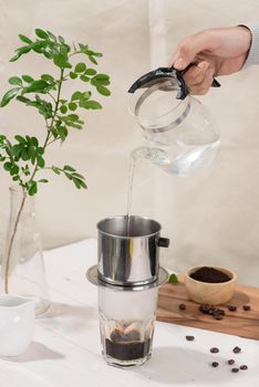 coffee dripping in vietnamese style on wooden table