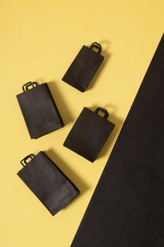 Black friday sale miniature mock up shopping bags black and yellow flat lay