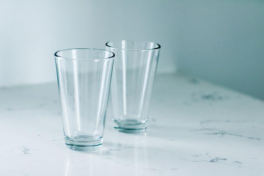 Clean empty glasses on marble table