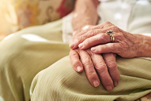 If hands could speak what story would they tell. an elderly womans hands resting on her lap.