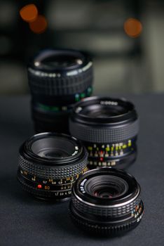 The correct lens makes all the difference. Studio shot of various camera lenses.