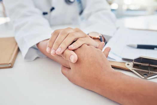 Hands, support and trust with a doctor and patient in the hospital for consulting, healthcare and medicine. Medical, care and help with a medicare professional and a victim in a clinic for health