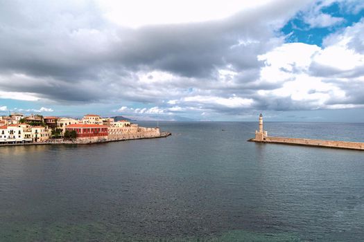 Landmarks of Crete - Panorama View of venetian port of Chania and lighthouse in old harbour of Chania, Greece.