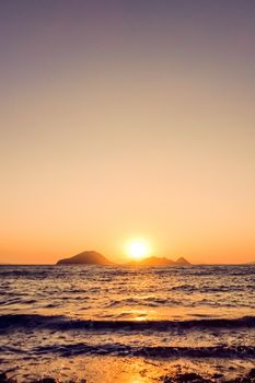 Summer sunset at the Mediterranean sea coast, seascape and mountain view