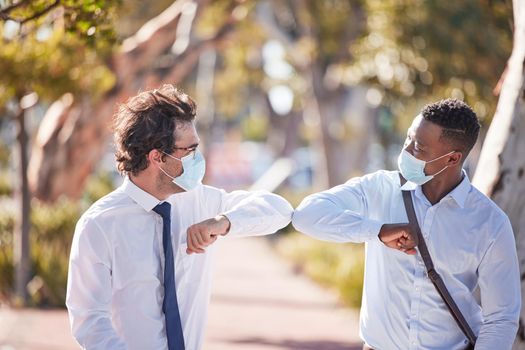 Covid greet, social distancing and elbow bump by business men meeting and greeting outdoors. Happy, friendly and excited colleagues using covid19 prevention protocol and wearing masks