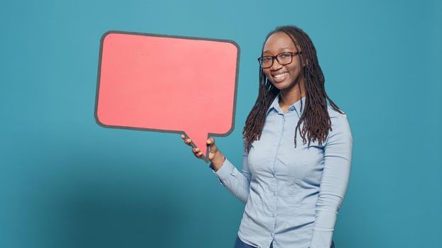 African american person holding mockup speech bubble