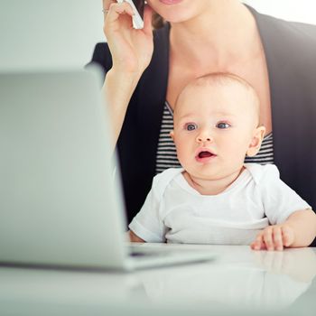 So this is work, huh. an adorable baby boy curious about his mothers work on her computer.