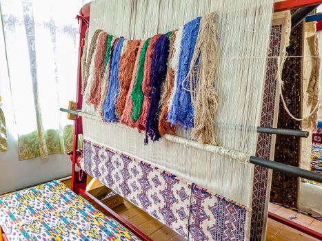 Workshop for the manual production of silk carpets in Central Asia. Uzbekistan