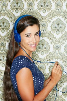 Listening to some new tunes. Portrait of an attractive young woman listening to music.