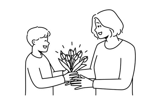 Smiling boy greeting granny with flowers