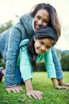 Everything a mother and daughter relationship should be. Portrait of a happy mother and daughter having fun outdoors.