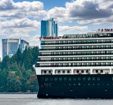 Huge ocean cruise ship leaving Vancouver's port for globe ocean tour