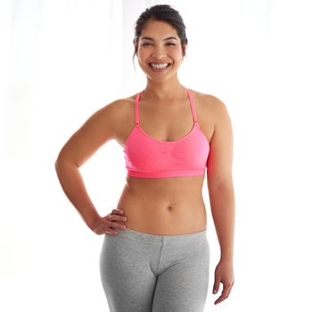 Being healthy and fit is a lifestyle. a young woman in exercise clothing against a white background.
