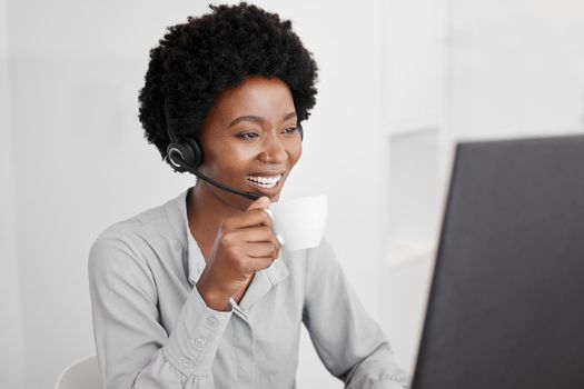 Call center, customer support and coffee with a woman consultant working on a computer in her office. Telemarketing, crm and contact us with a female consulting for help and service with a headset