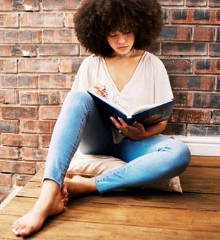 Woman reading books, story and study at home for relaxed learning, studying and education. College student, young black person on ground and interesting story for research, literacy and knowledge