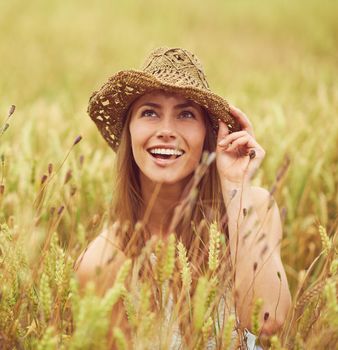 Adventure awaits. a young woman in a wheat field.