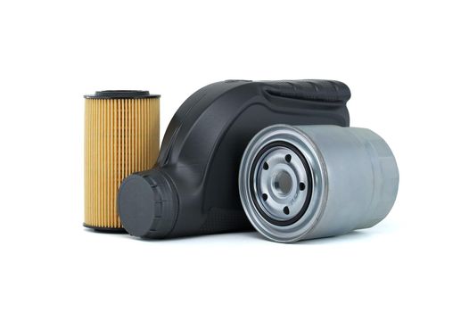 Motor oil container and filters over a white