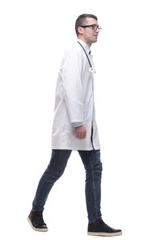 doctor in a white coat striding forward.