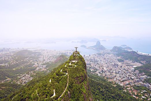 Christ the Redeemer overlooking the city Rio. Aerial view of Rio De Janeiro, Brazil.
