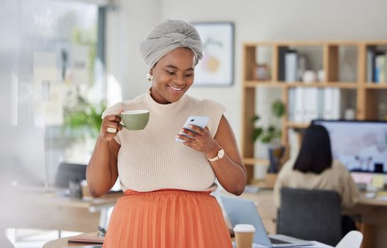 Girl on office coffee break with phone texting, internet or web search and relax in startup business or company. Black woman working in social media content writing on lunch break drinking tea