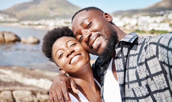 Black couple, selfie and smile for happy beach fun, carefree and relaxing sunny day outdoors. Portrait of love, summer and african people with photos on holiday, romance getaway and honeymoon date